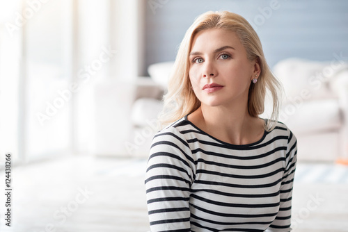 Blond lady against blurred background