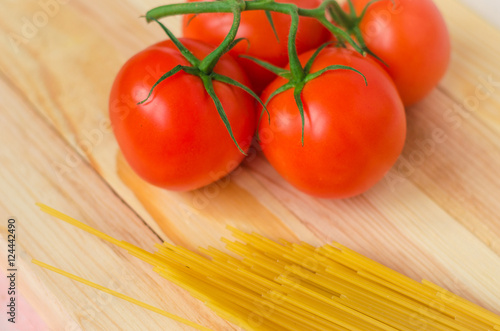 Ingredients for tasty pasta: spaghetti with tomatoes.