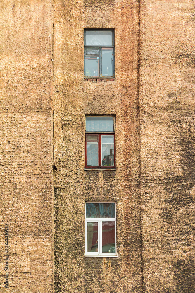 Several windows in row on facade of urban apartment building front view, St. Petersburg, Russia. Several windows in row on facade of urban apartment building front view, St. Petersburg, Russia.
