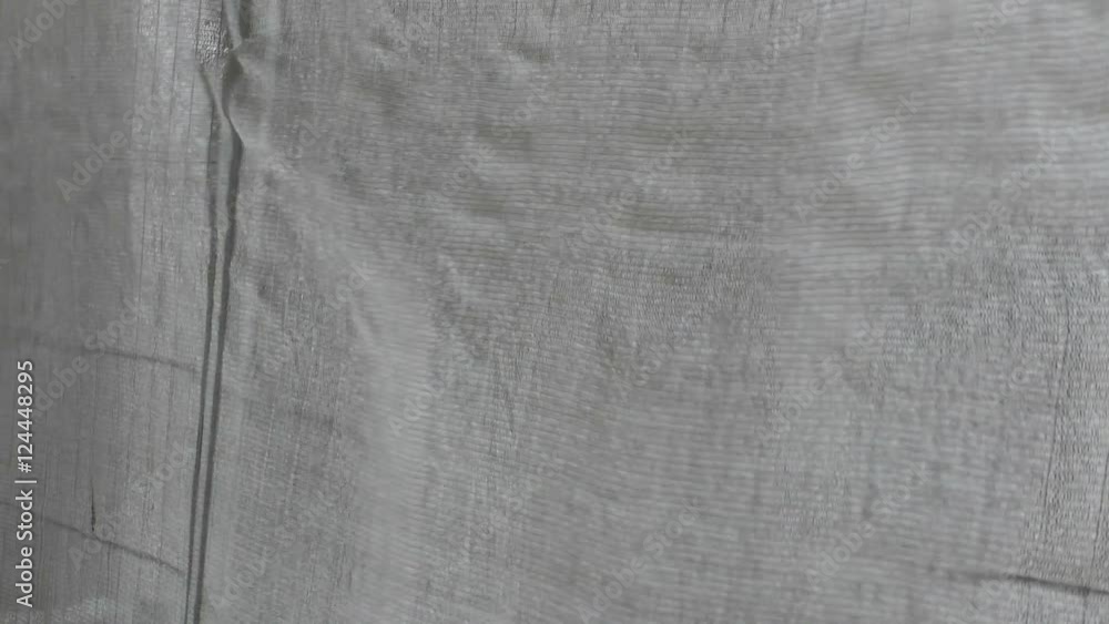 Grey industrial canvas fluctuate on the wind. High definition footage for a background. Grey industrial canvas fluctuate on the wind. High definition footage for a background.