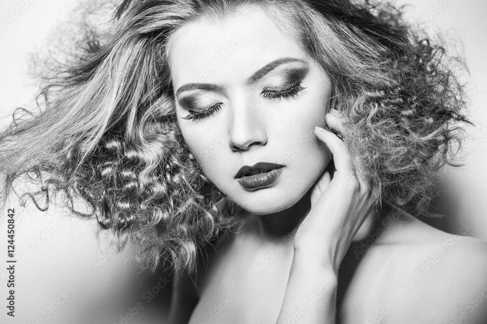 Fototapeta premium Beauty young woman with curly big and long permed hair.