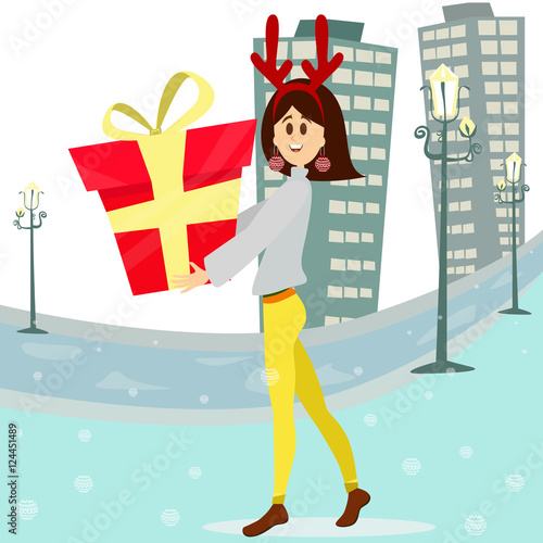 Happy woman carrying a big gift box.