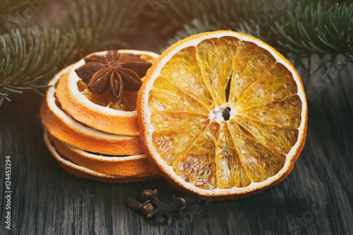 dried oranges and anise stars on wood table