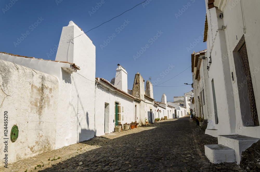 streetview in alentejo, small village with white traditional houses. evoramonte, portugal