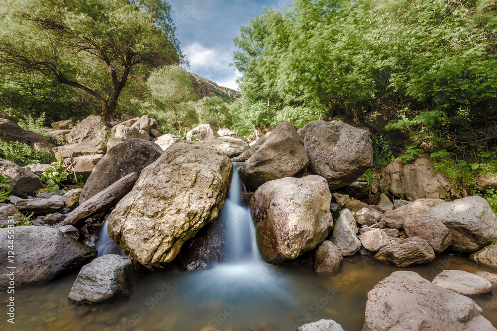 Fototapeta premium View of beautiful mountain waterfall. Exploring Armenia