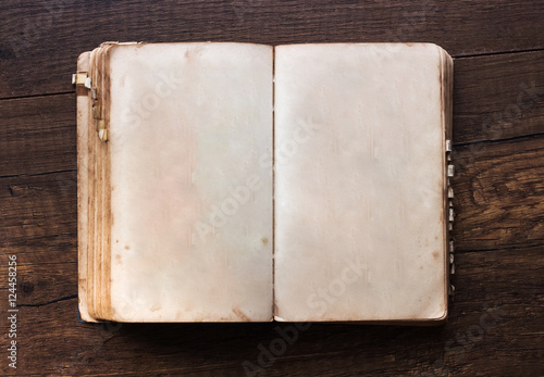 Obraz na płótnie Vintage book, open, on old wooden table. w salonie