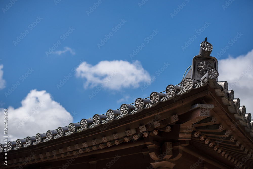 Buddhist temple roof tile and eaves with blue sky Buddhist temple roof tile and eaves with blue sky