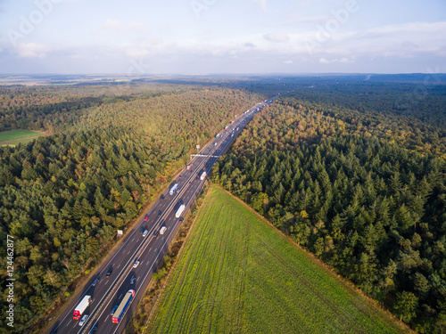 Green cultivated fields by highway in Netherlands © alexkazachok