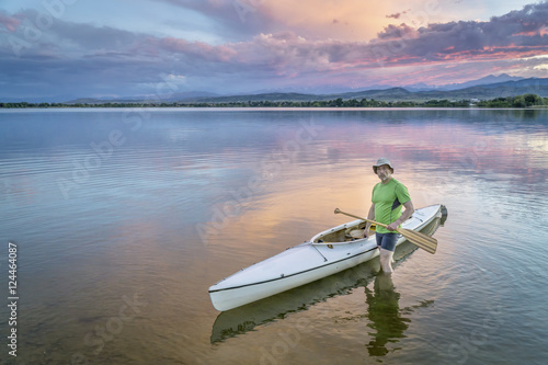 paddler and canoe at dusk