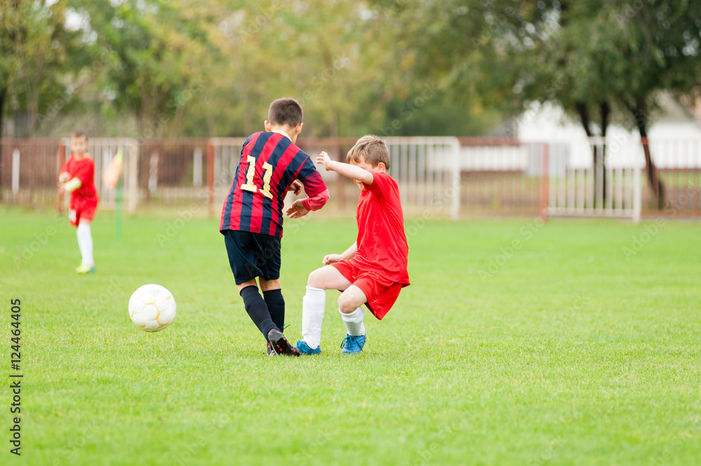 Two young soccer football players fighting for the ball Two young soccer football players fighting for the ball
