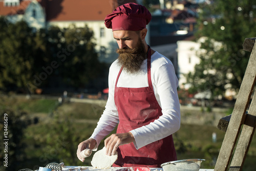 Man cook with rolling pin © Volodymyr