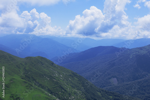 Beautiful mountains view. Natural background. High in the mountains. Landscape with alpine meadows.