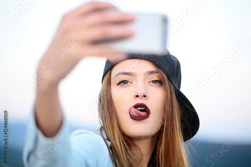 Young sexy girl making selfie