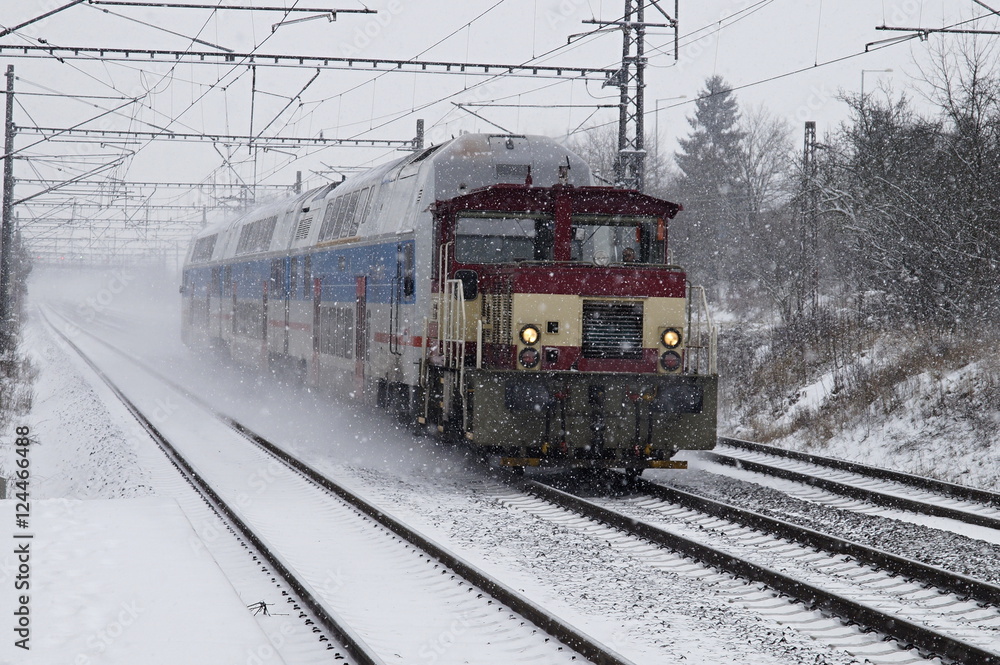 Electric train in snow storm.