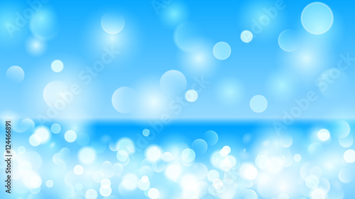 Abstract background with bokeh effect in light blue
