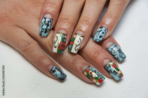 black, blue, white, green manicure with cracks on the long square nails