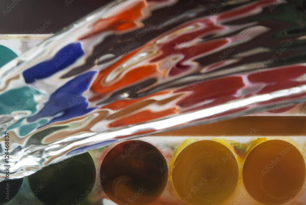 Naklejka premium photo of paints being splashed with water