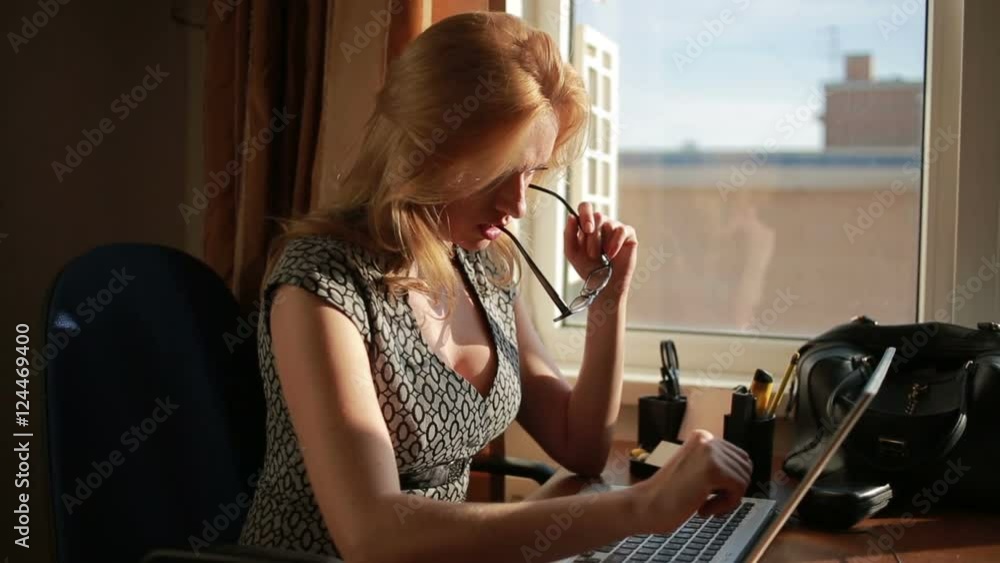 Busty sexy business woman working for a laptop. sucks glasses Stock Video |  Adobe Stock