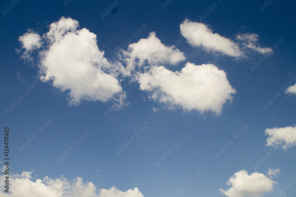 Brilliant blue sky with fluffy white clouds floating to eternity. Brilliant blue sky with fluffy white clouds floating to eternity.