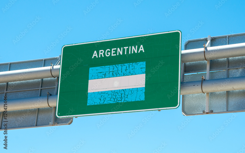 Highway sign marking the border between Argentina and Chile in the Atacama Desert in the Andes Mountains