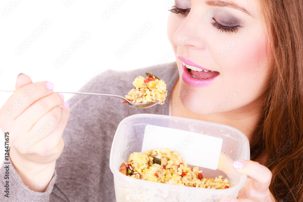 Woman eat oatmeal with dry fruits. Dieting Woman eat oatmeal with dry fruits. Dieting