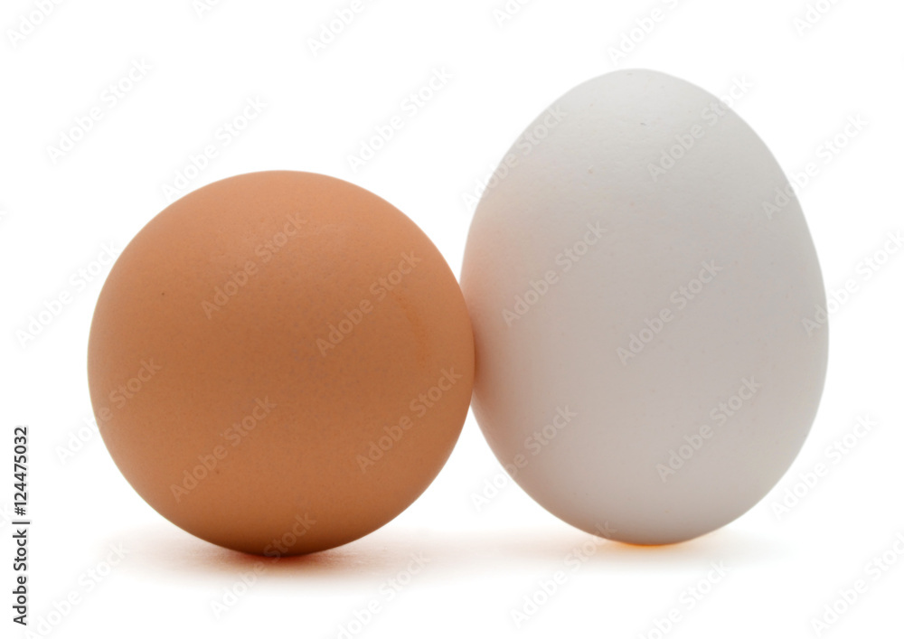 Two white and brown eggs isolated on white background Two white and brown eggs isolated on white background