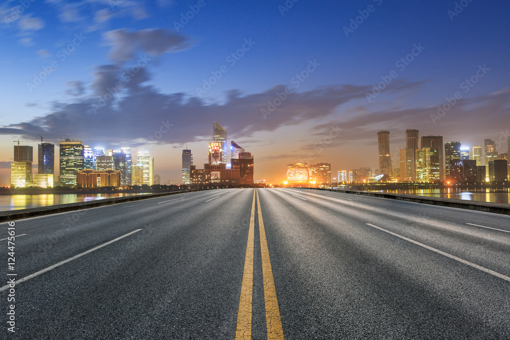 Asphalt roads and beautiful cityscape at dusk in Hangzhou
