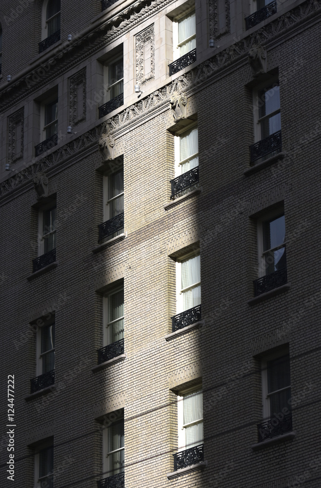  window in the shadow of a building in downtown San Francisco.