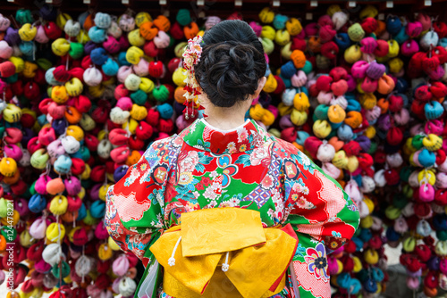 Wallpaper Mural Woman dressed in kimono at colorful background, Kyoto, Japan
