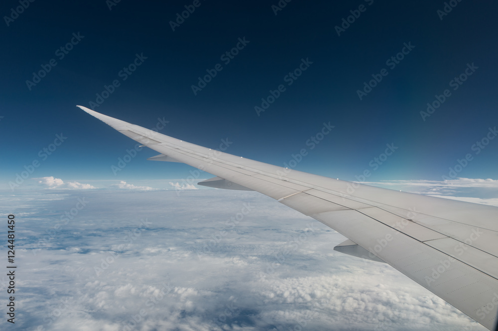 Airplane wing with sunset and beautiful cloudy Airplane wing with sunset and beautiful cloudy