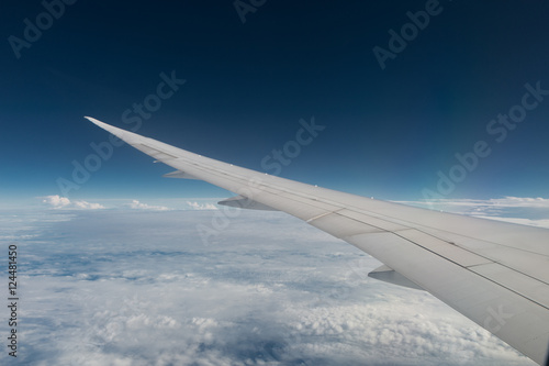 Airplane wing with sunset and beautiful cloudy