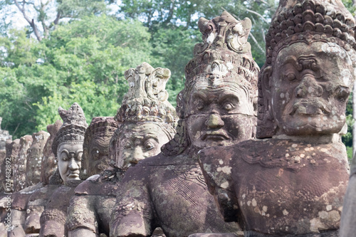 Demon or Asuras ( in Sanskrit) row at entrance of Angkor Thom,Siem Reap, Cambodia. © todsaporn
