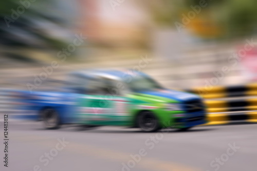 Race car racing on speed track with motion blur