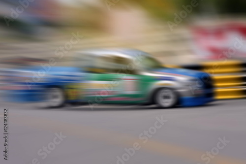 Race car racing on speed track with motion blur