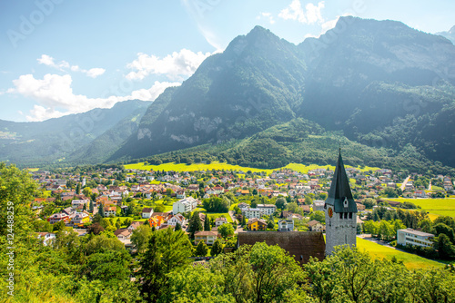 Landscape view on Balzers village with saint Nicholas church in Liechtenstein photo