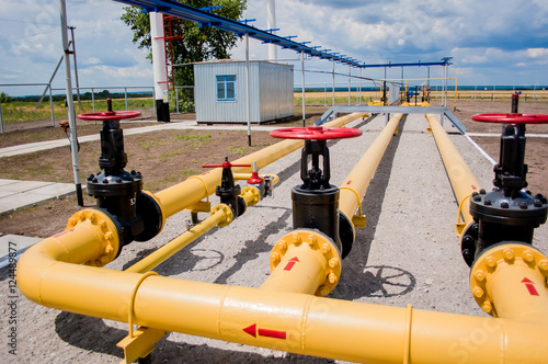 Red faucet with steel pipe in natural gas treatment plant