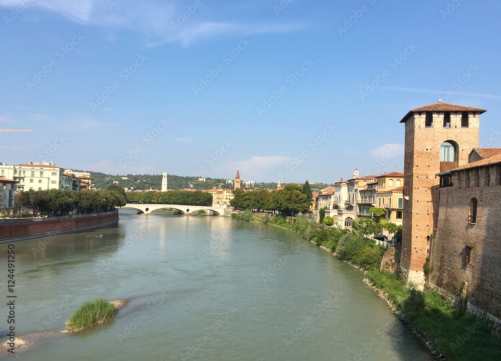 VERONA, ITALY - SEPTEMBER 3, 2016 : cityscape of the old town of Verona and its river during summer.