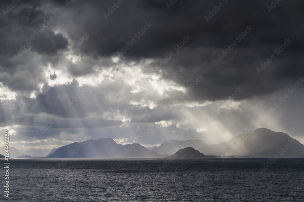 Sunbeams at a fjord near Alesund