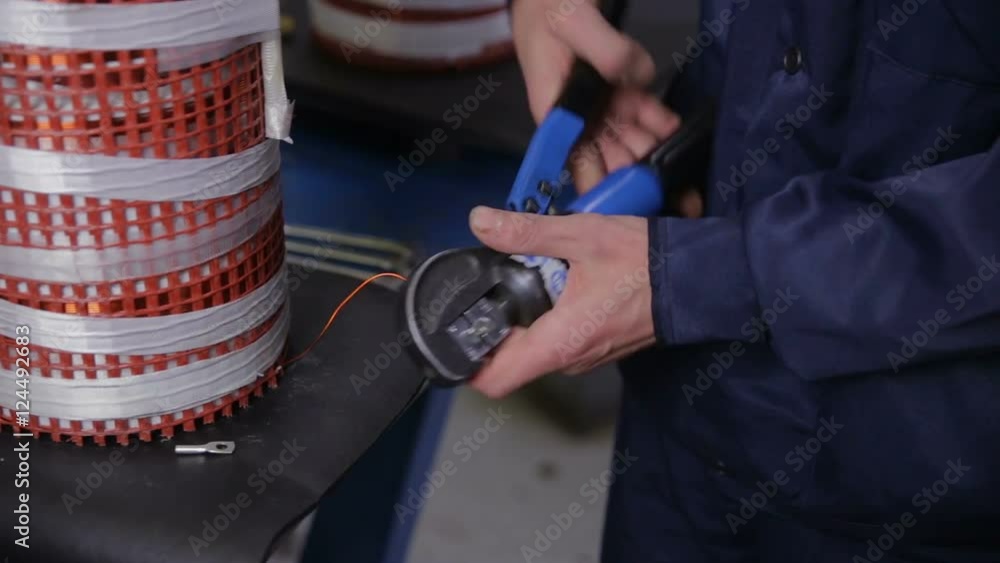 Transformer Assembly Line Factory worker assembling electric equipment - transformer - on ...