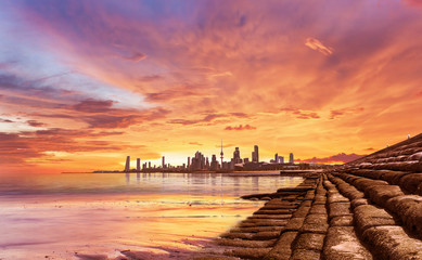 Papier peint photo Corail Kuwait City landscape view during beautiful golden sunset on summer time  © Arlo Magicman