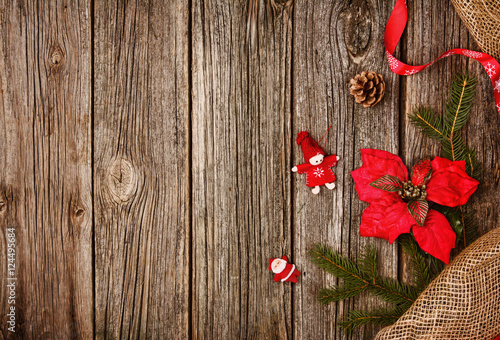 Christmas decoration background over wooden table and linen cloth.