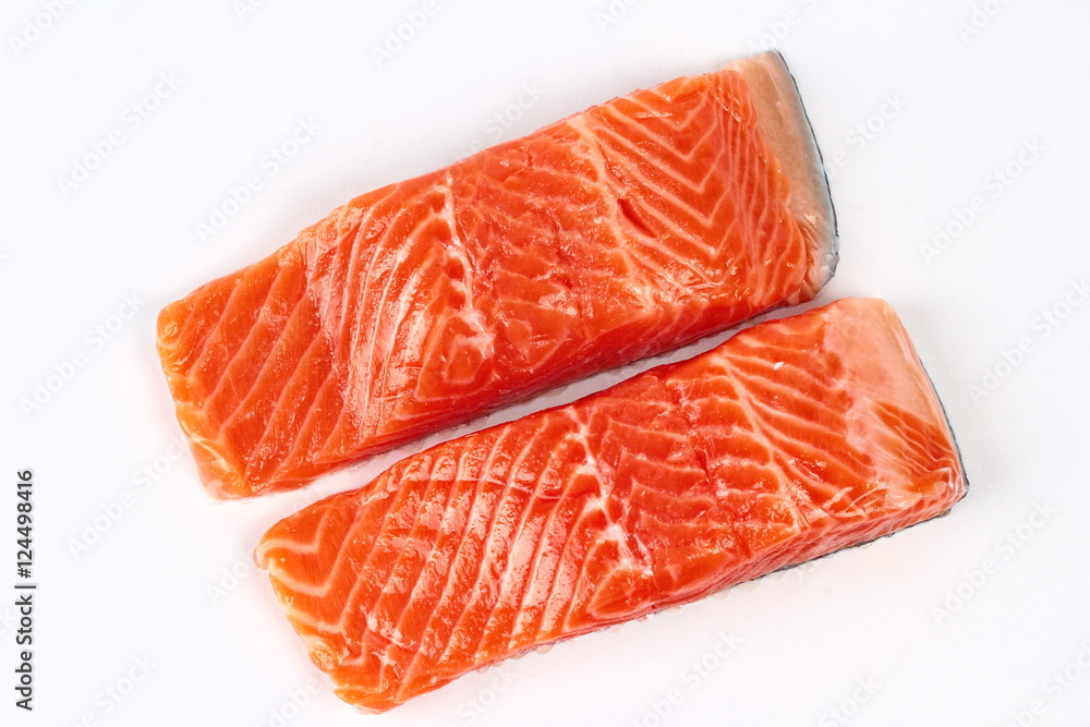 Ready raw fresh salmon for cooking or served isolated on white background Ready raw fresh salmon for cooking or served isolated on white background
