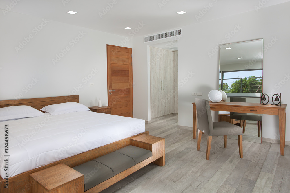 Fototapeta premium Panoramic view of nice white stylish modern bedroom