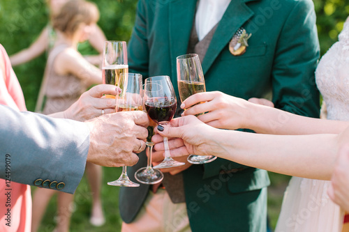 glasses in hands of guests at a wedding party. wedding party. gl