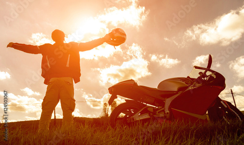 Fotografie Silhouette of a sport motorbike and biker.