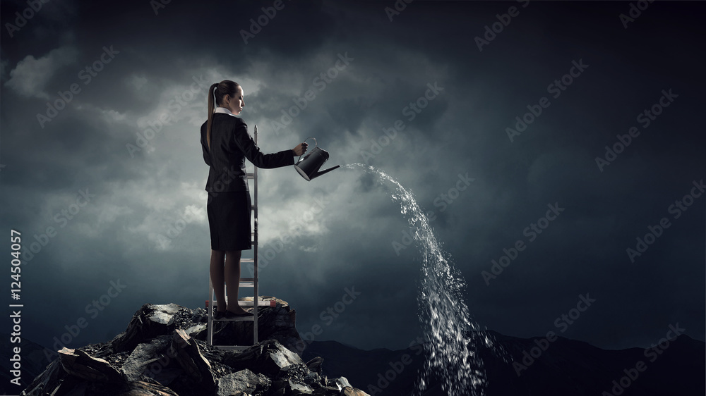 Obraz premium Businesswoman on ladder top . Mixed media