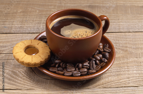 Cup of coffee with biscuit