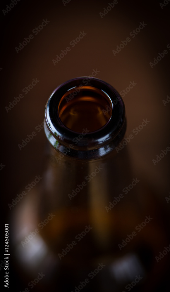 Bottle of beer on wooden table