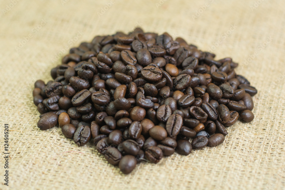 coffee seeds on jute bag background coffee seeds on jute bag background