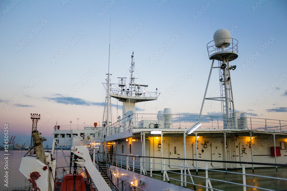 White cargo ship  at dawn